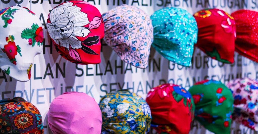 A vibrant display of colorful patterned hats against a backdrop with text.